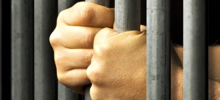 7776-jail-prisoner-bars-hands-091412