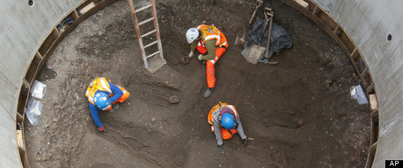 In this undated but recent photo supplied Friday March 15, 2015, by the London Crossrail Project, showing archaeologists working on the UKs largest infrastructure project, Crossrail, as they uncover an historical burial ground at Charterhouse Square, Farringdon in central London. (AP Photo / Crossrail Project)
