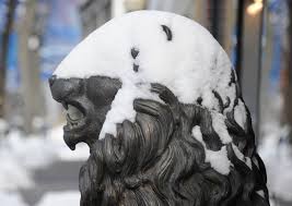 snow covered lion statue